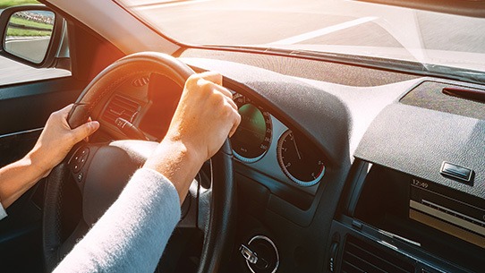 Hands on a steering wheel